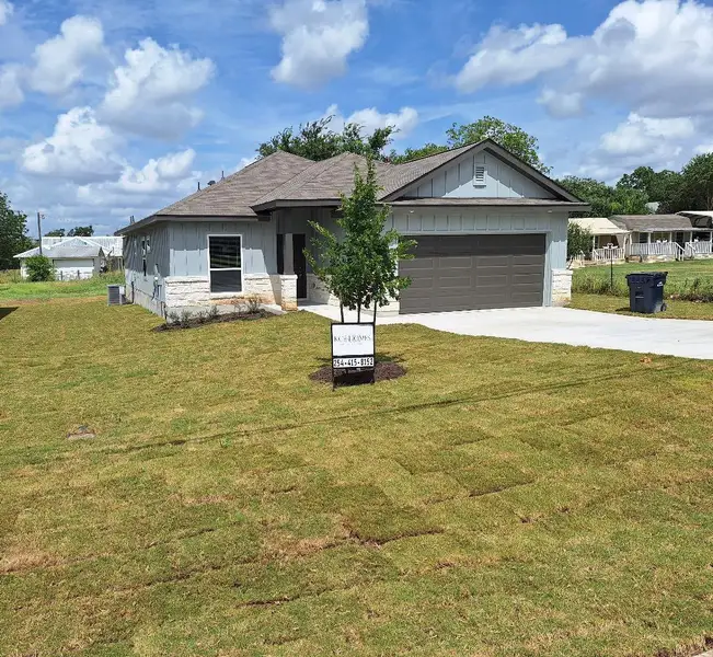 Front exterior of a new home in , Florence, TX, highlighting curb appeal (Image 1).