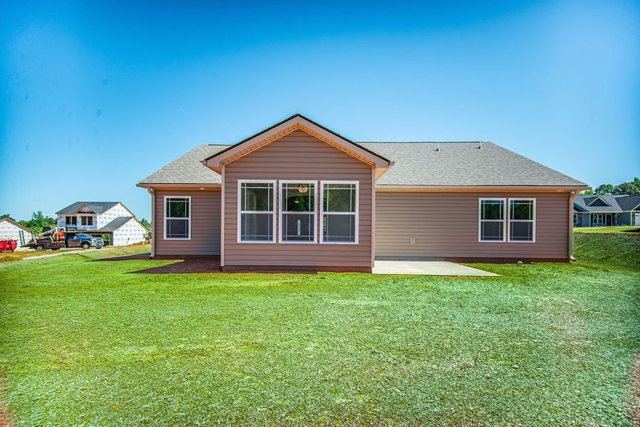 Representative exterior photo of a completed home built from the Jackson by Enchanted Homes in Ballentine Ridge, Lyman, SC (Image 24).