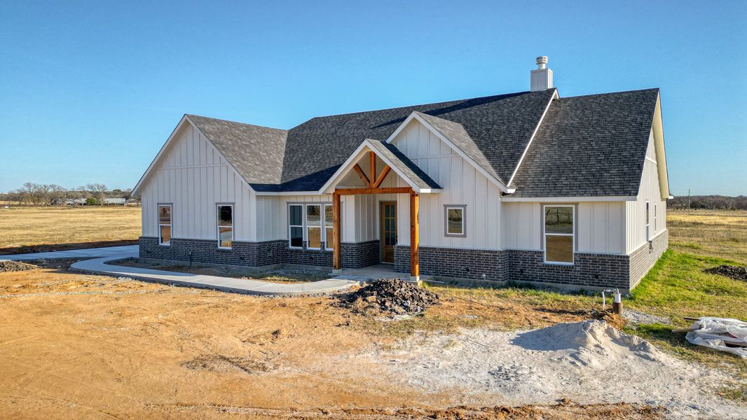 Representative exterior photo of a completed home built from the Jarrett 1 by Zeal Home Builders in Saddle Crest Estates, Weatherford, TX (Image 24).