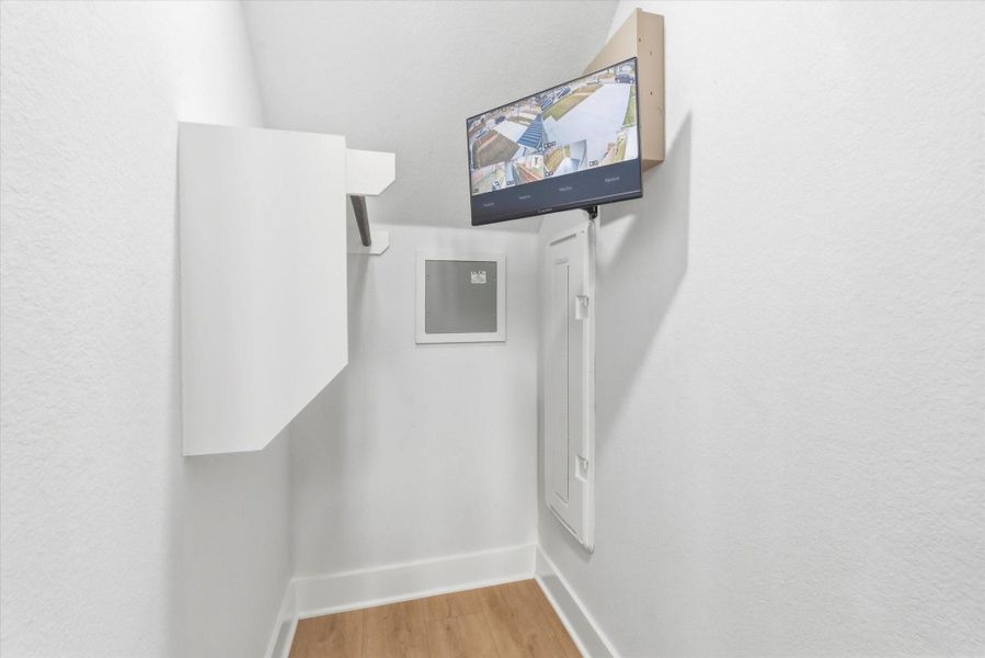 This storage space offers an integrated security system monitor for added convenience.