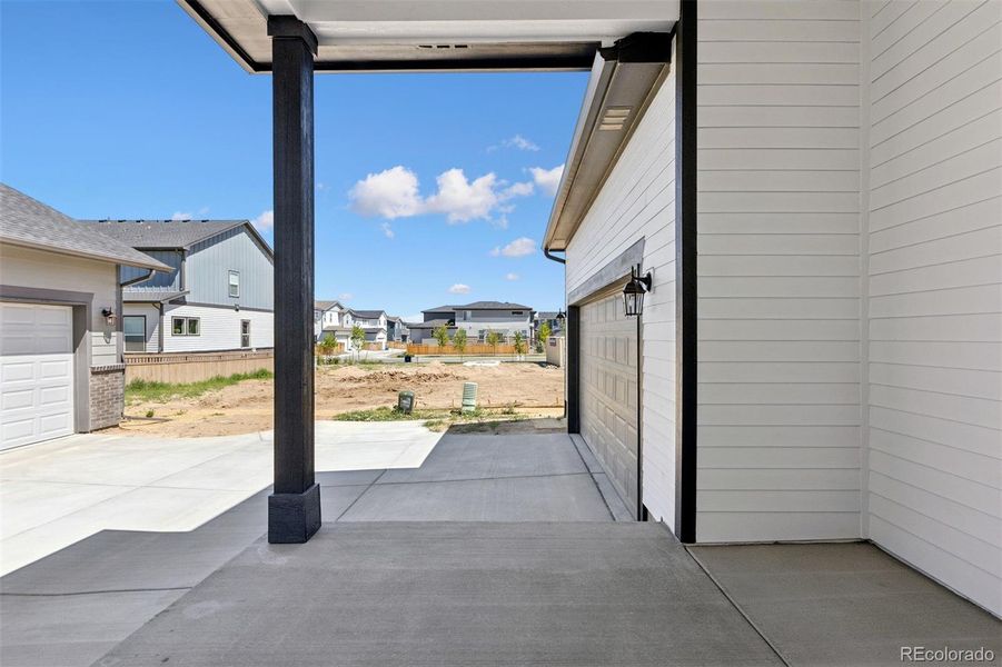 Front exterior of a new home in Painted Prairie Cottage, Aurora, CO, highlighting curb appeal (Image 21).
