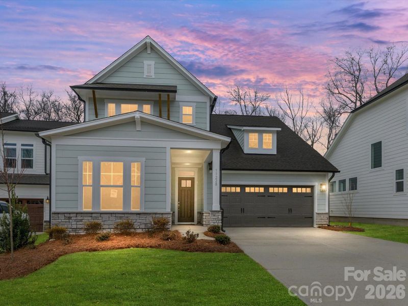 Front exterior of a new home in North Creek Village, Huntersville, NC, highlighting curb appeal (Image 19). Front exterior of a new home in North Creek Village, Huntersville, NC, highlighting curb appeal (Image 19).