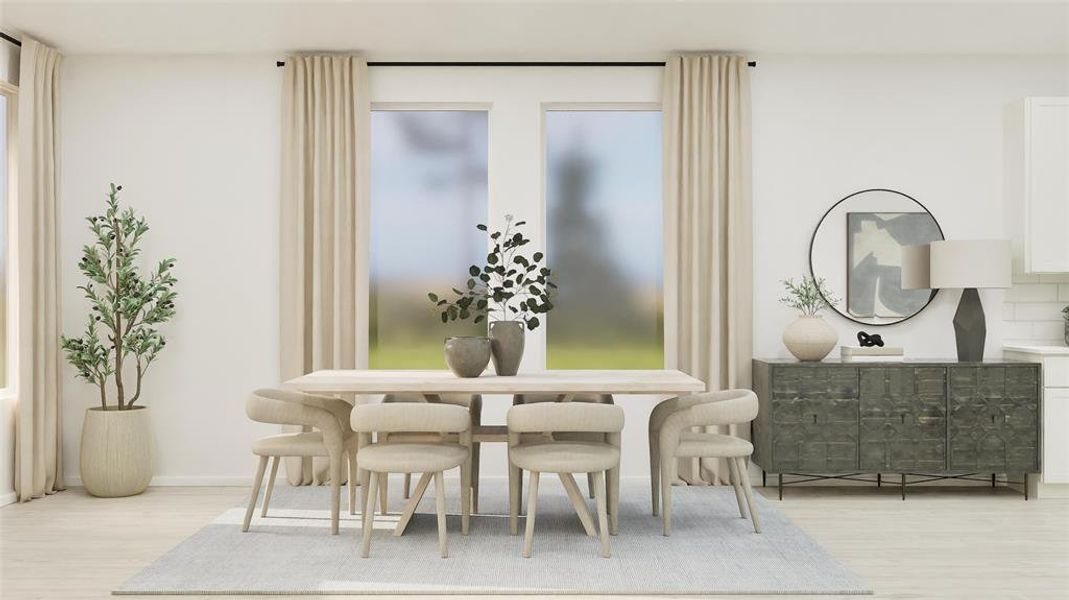 Dining area with light wood-type flooring and baseboards Dining area with light wood-type flooring and baseboards