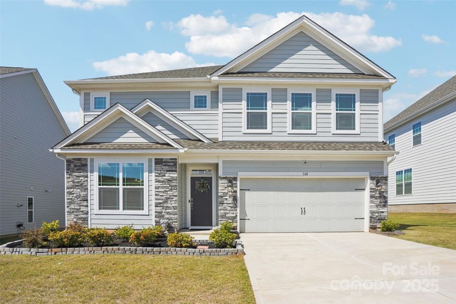 Front exterior of a new home in Falls Cove, Troutman, NC, highlighting curb appeal (Image 2).
