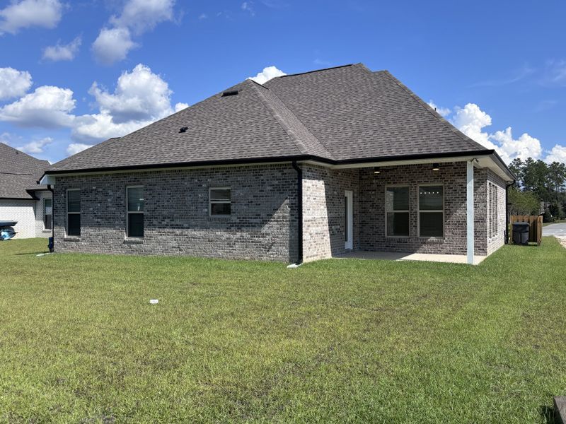 Exterior details and patio area of a home in Bird Song at Hammock Bay, Freeport (Image 21).