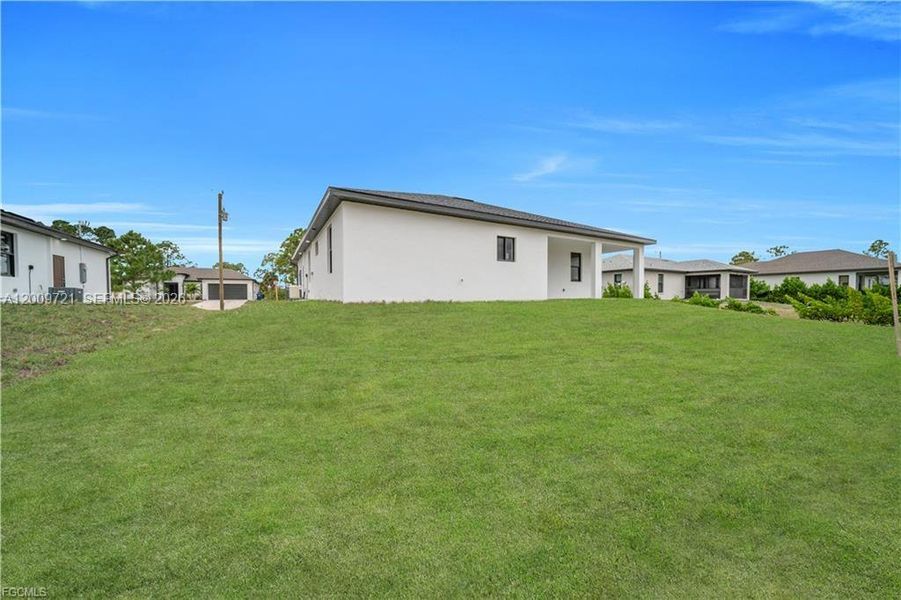 Exterior details and patio area of a home in , Lehigh Acres (Image 16).
