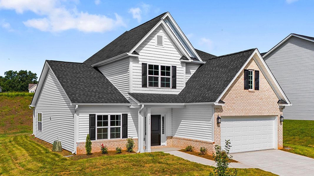Front exterior of a new home in Brooke Hill, Lewisville, NC, highlighting curb appeal (Image 2). Front exterior of a new home in Brooke Hill, Lewisville, NC, highlighting curb appeal (Image 2).