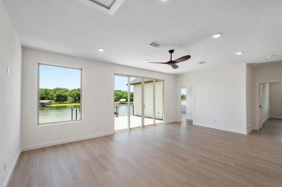 2nd floor family room with water views, patio access, & full bath.