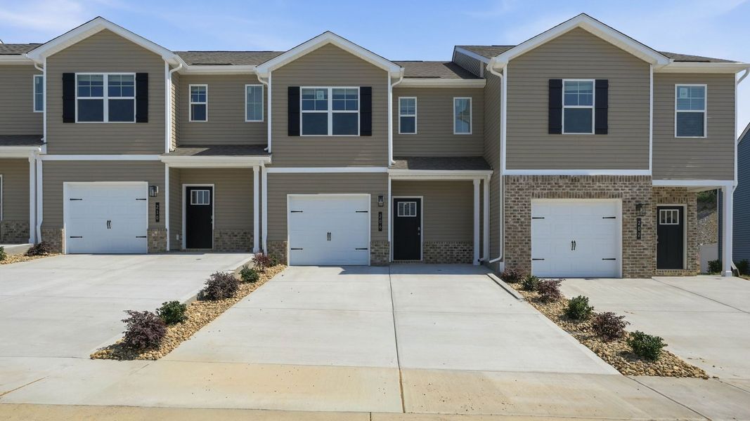 Front exterior of a new home in Cherokee Crossing, Kodak, TN, highlighting curb appeal (Image 1). Front exterior of a new home in Cherokee Crossing, Kodak, TN, highlighting curb appeal (Image 1).