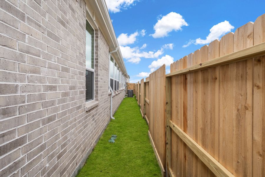 Exterior details and patio area of a home in Riceland, Mont Belvieu (Image 19).