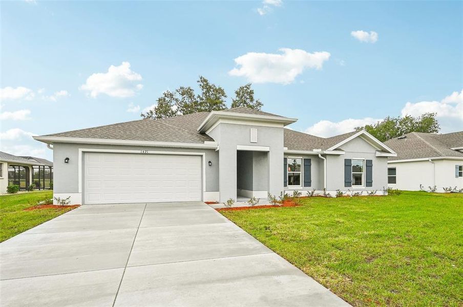 Front exterior of a new home in Sugarmill Woods, Homosassa, FL, highlighting curb appeal (Image 18). Front exterior of a new home in Sugarmill Woods, Homosassa, FL, highlighting curb appeal (Image 18).