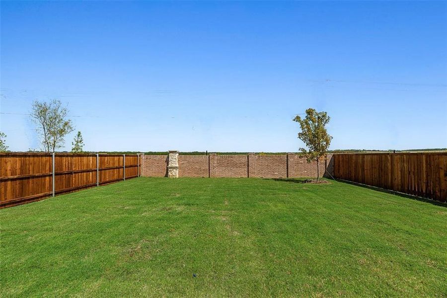 Front exterior of a new home in Arbors at Legacy Hills, Celina, TX, highlighting curb appeal (Image 17).