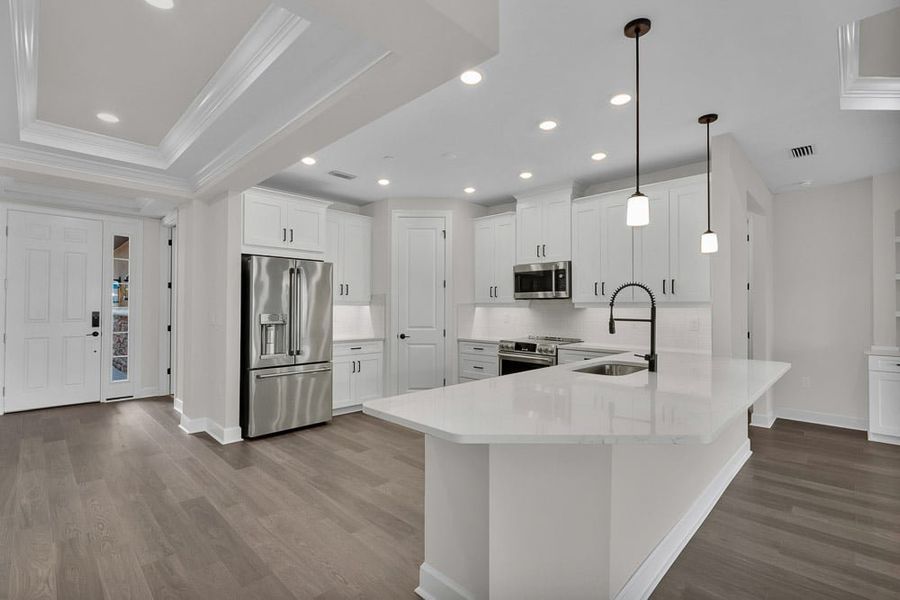 Furnished interior view inside a new home in Esplanade by the Islands Coach Homes, Naples (Image 5). Furnished interior view inside a new home in Esplanade by the Islands Coach Homes, Naples (Image 5).