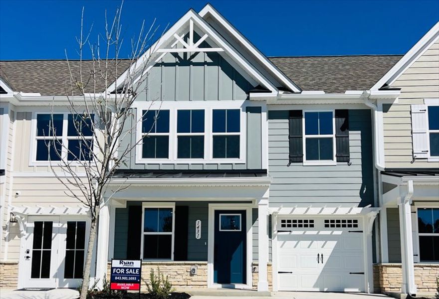 Exterior details and patio area of a home in Hope Pointe Townhomes, North Myrtle Beach (Image 1).