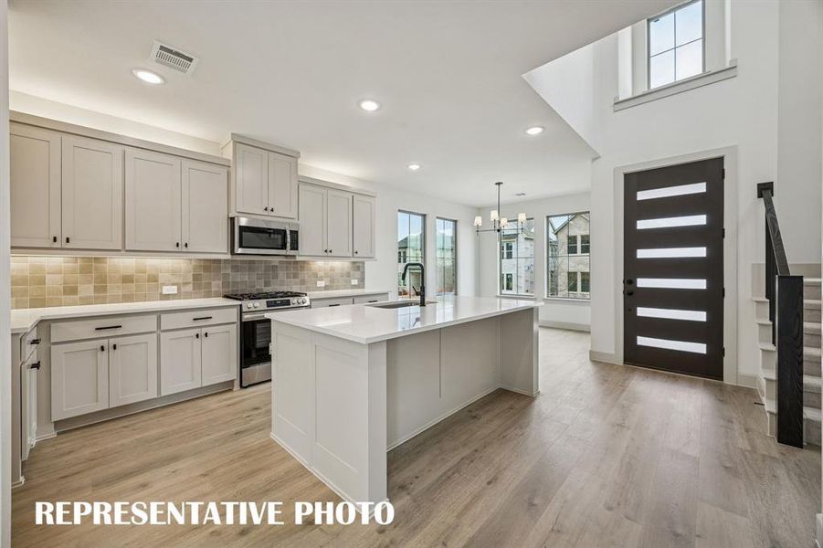 Open and light filled, this dream kitchen is the perfect place to host family and friends.  REPRESENTATIVE PHOTO