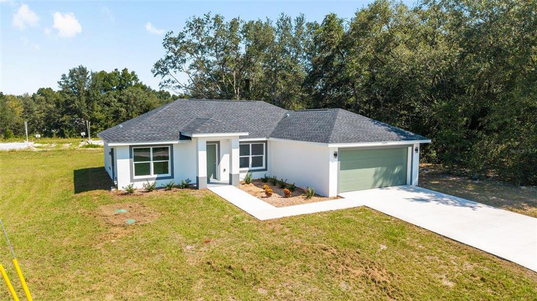Front exterior of a new home in , Dunnellon, FL, highlighting curb appeal (Image 12).
