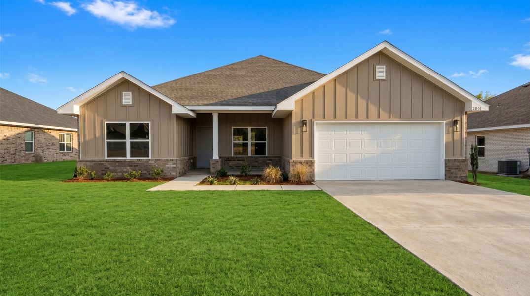 Front exterior of a new home in Brookwood, Crestview, FL, highlighting curb appeal (Image 1). Front exterior of a new home in Brookwood, Crestview, FL, highlighting curb appeal (Image 1).