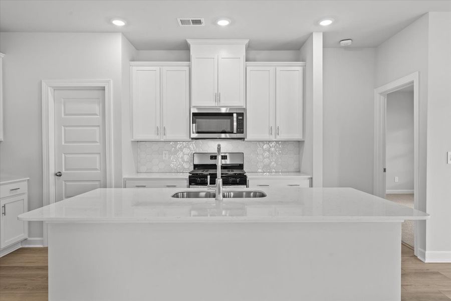 Furnished interior view inside a new home in The Farm at Wells Creek - Signature Collection, Gray Court (Image 5).