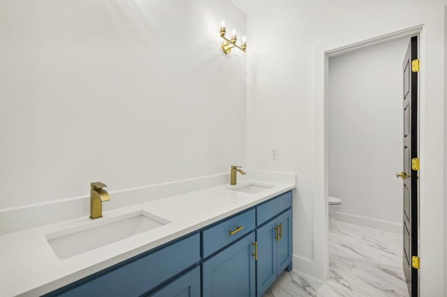 Bathroom with vanity and toilet