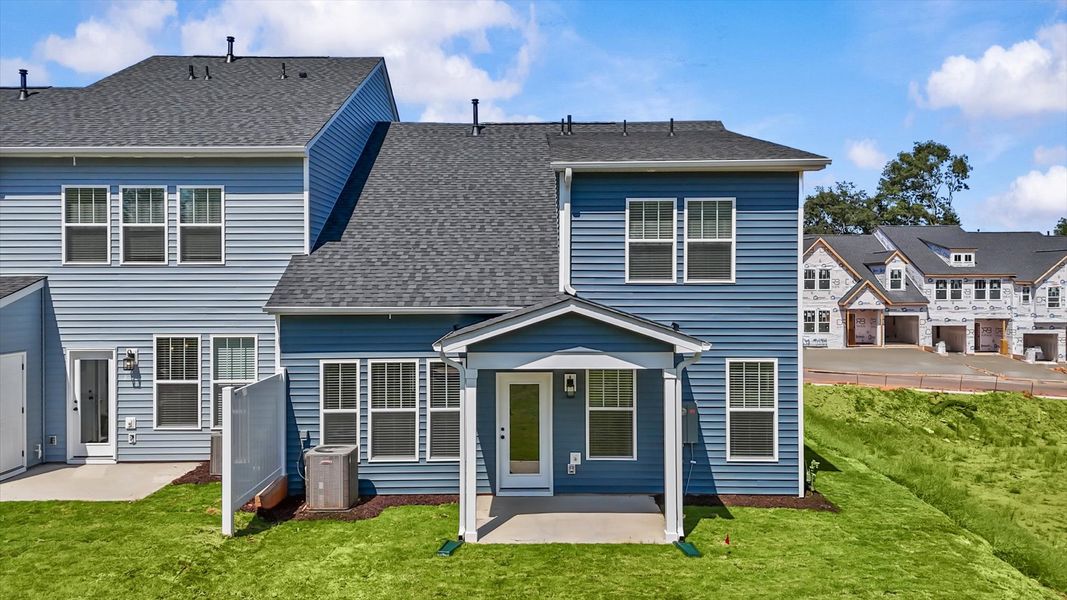 Warm and inviting outdoor living space with a covered rear porch and tasteful finishes