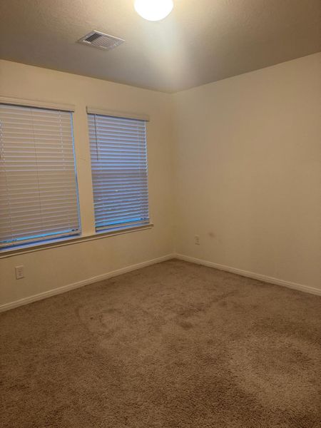 Spacious, unfurnished interior of a new home in Sunterra, Katy (Image 19).