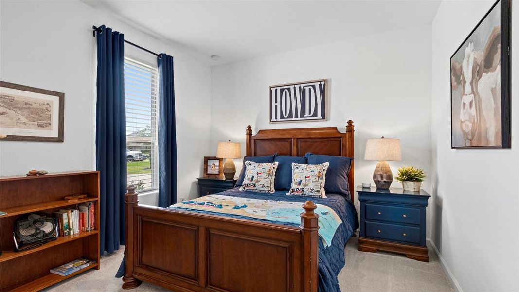This secondary bedroom features high-set windows with window treatments, offering natural light, privacy, and flexible functionality. This secondary bedroom features high-set windows with window treatments, offering natural light, privacy, and flexible functionality.