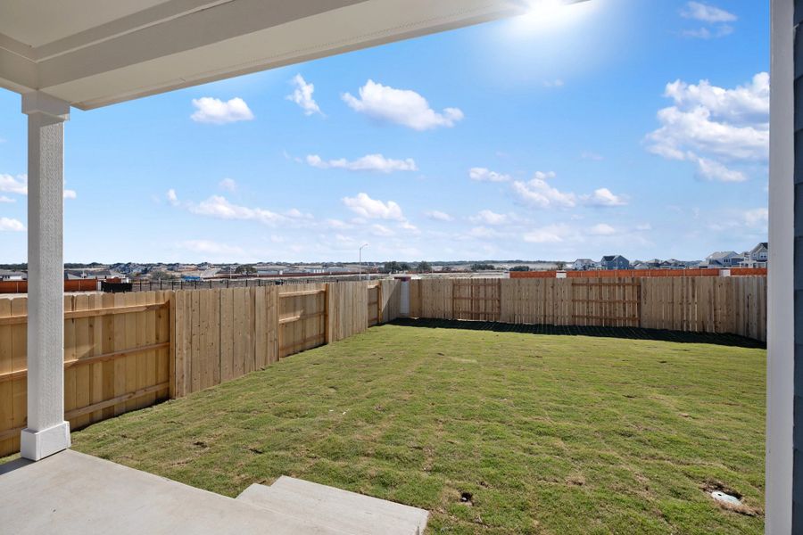 Exterior details and patio area of a home in The Homestead at Lariat, Liberty Hill (Image 28).