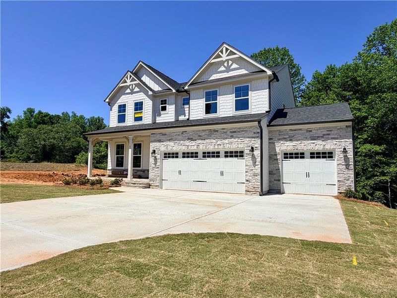 Front exterior of a new home in Arbor West, Dawsonville, GA, highlighting curb appeal (Image 2).