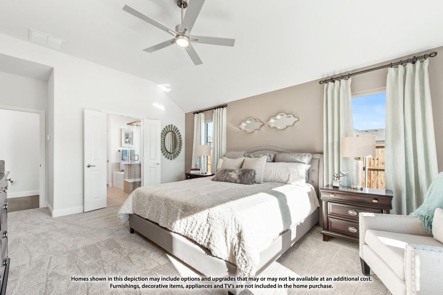 Master bedroom with vaulted ceiling, ceiling fan, carpet flooring, and ensuite bathroom access Master bedroom with vaulted ceiling, ceiling fan, carpet flooring, and ensuite bathroom access