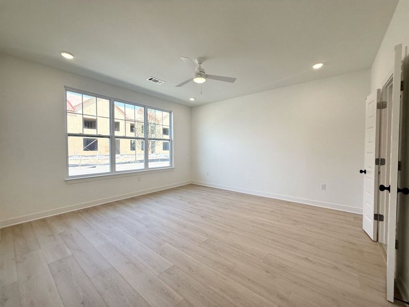 Spare room with a ceiling fan, recessed lighting, and light wood-style flooring