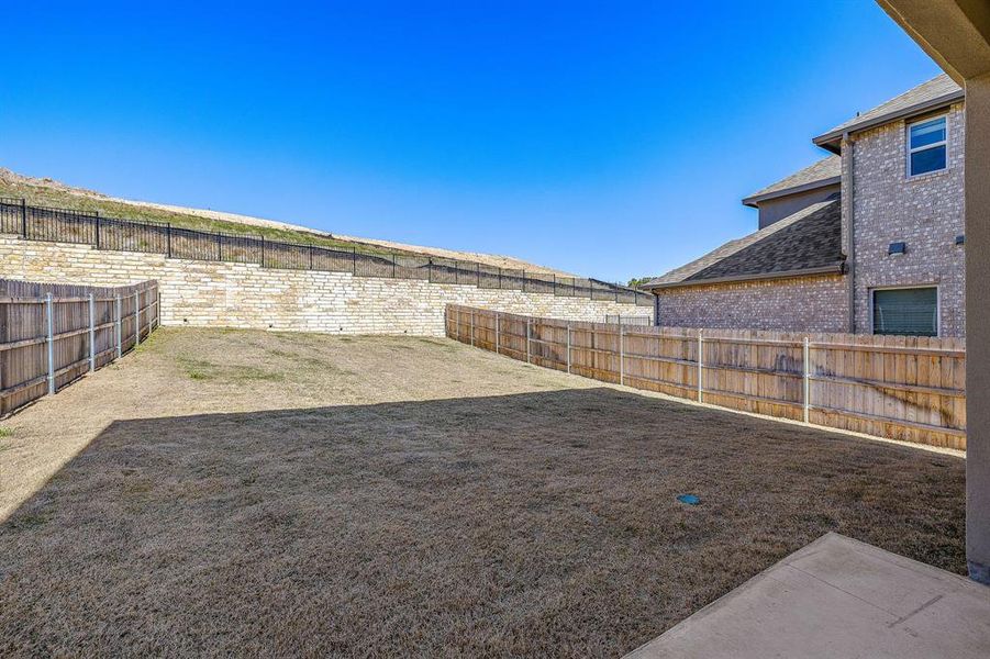 Terraced backyard with rock retaining wall