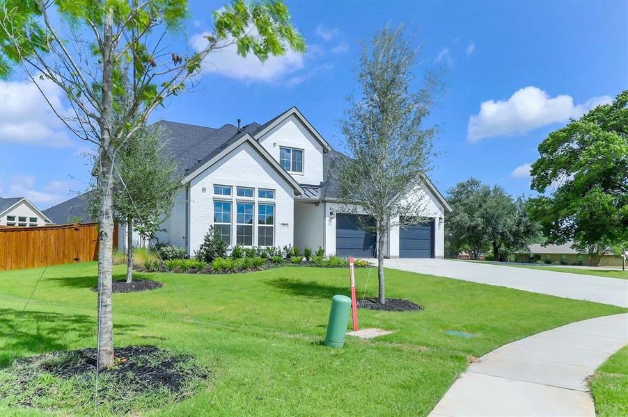 White brick exterior with dark gray roofing White brick exterior with dark gray roofing