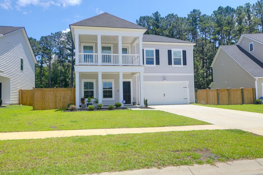 Exterior details and patio area of a home in Sweetgrass at Summers Corner: Arbor Collection, Summerville (Image 1).