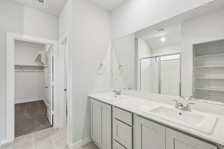 Primary Bathroom in the Oscar home plan by Trophy Signature Homes – REPRESENTATIVE PHOTO