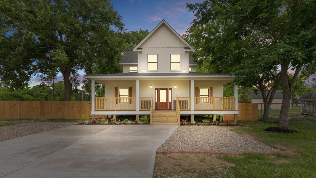 This charming 2-story welcomes you! The Double Driveway is perfect for multiple vehicles, and a full-length porch stretches across the front of the home.