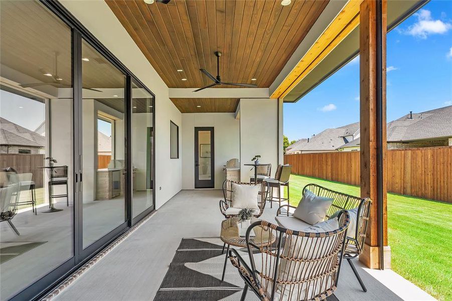 Fenced backyard with a ceiling fan Fenced backyard with a ceiling fan