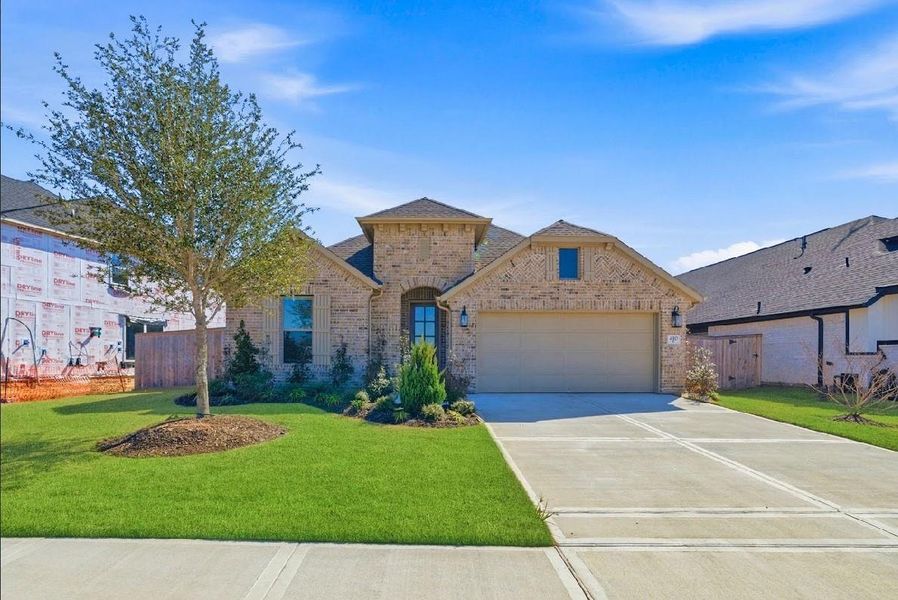 Front exterior of a new home in Candela, Richmond, TX, highlighting curb appeal (Image 1). Front exterior of a new home in Candela, Richmond, TX, highlighting curb appeal (Image 1).