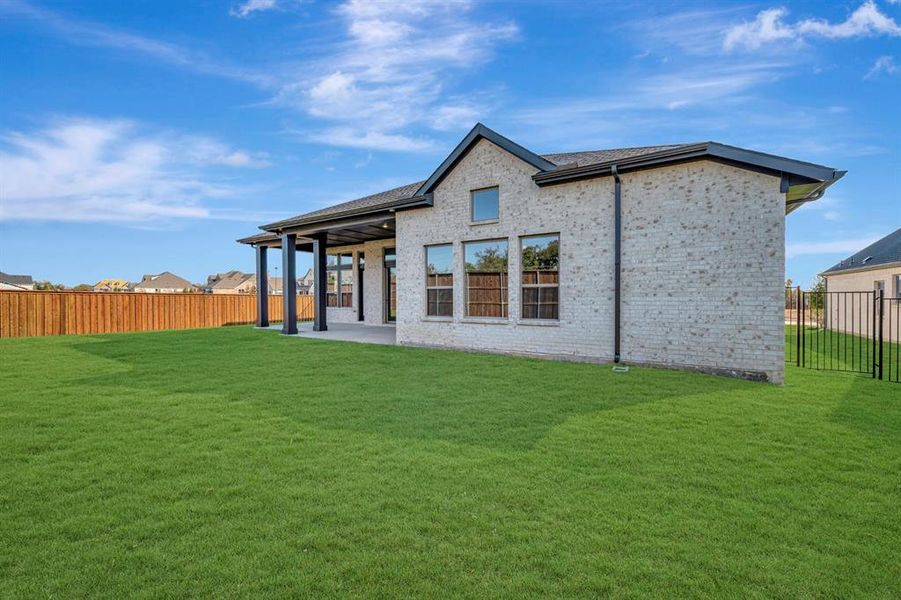 Exterior details and patio area of a home in Northshore at Lakewood Village - Garden Series, Lakewood Village (Image 3). Exterior details and patio area of a home in Northshore at Lakewood Village - Garden Series, Lakewood Village (Image 3).