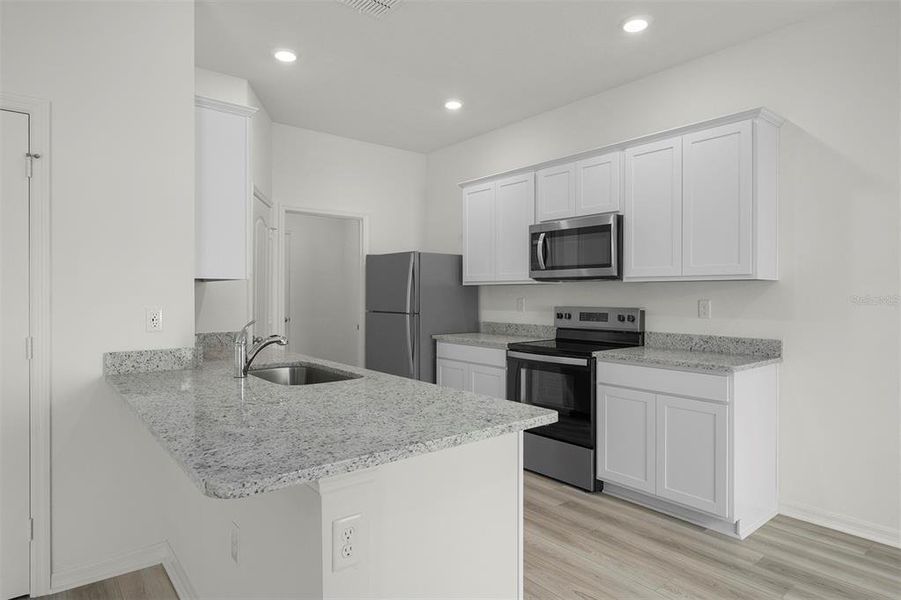 Furnished interior view inside a new home in Tula Parc, Astatula (Image 5).