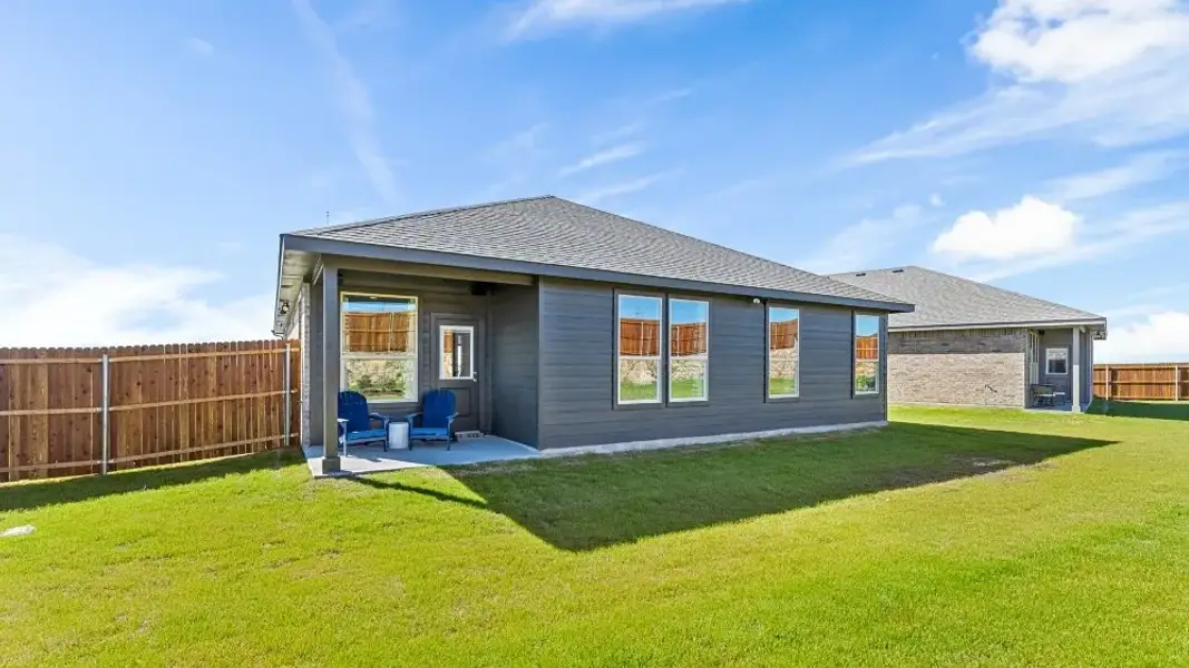 Exterior details and patio area of a home in Bluestem, Rhome (Image 2).