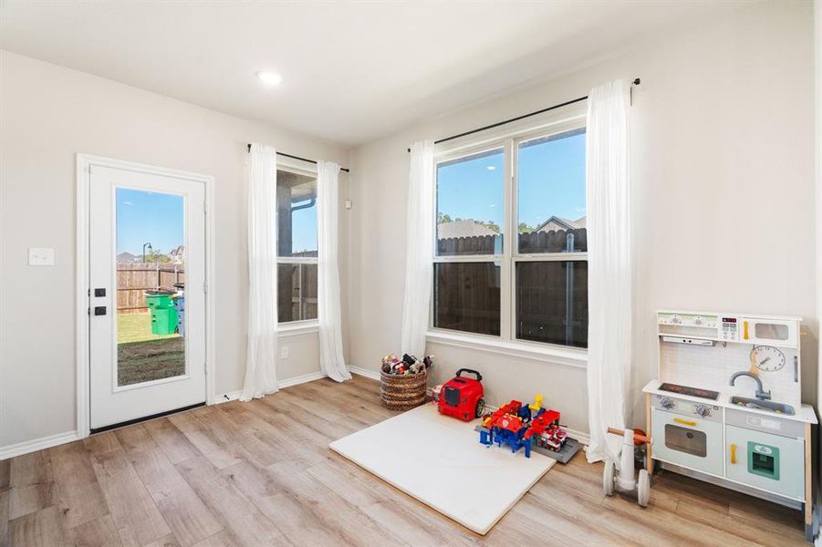 Game room with light wood-style floors and recessed lighting Game room with light wood-style floors and recessed lighting