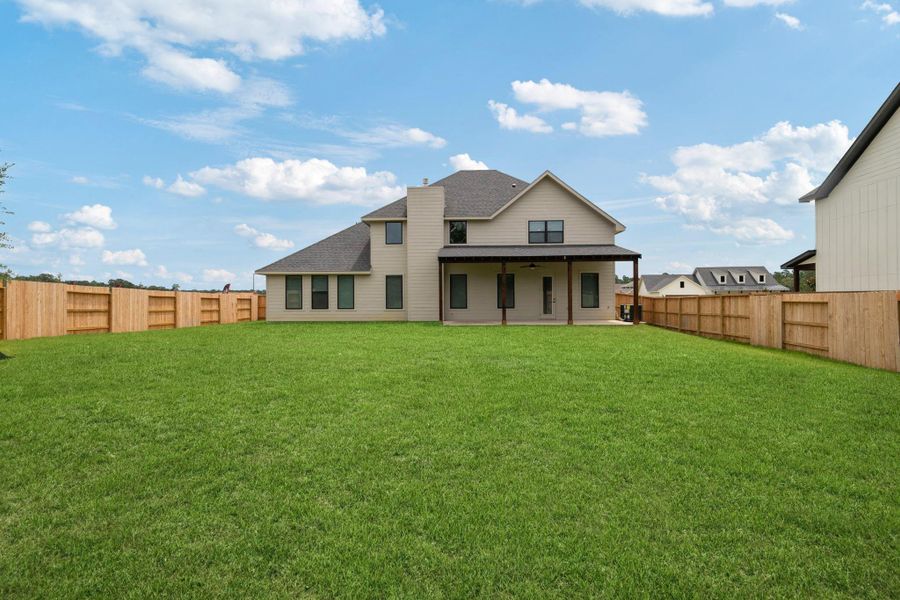 Exterior details and patio area of a home in Magnolia Woods - 70', Magnolia (Image 3).
