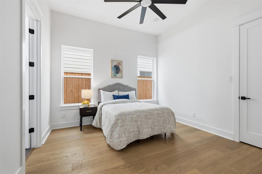 Just beyond the office, a well-appointed guest suite offers comfort and privacy with a walk in closet, an en-suite bath, and a private exterior exit. Perfect for hosting overnight guests with ease.