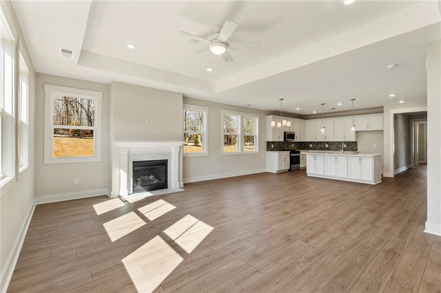 This airy open-concept space features warm floorin This airy open-concept space features warm floorin