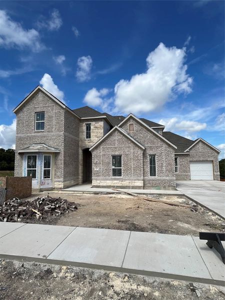 Front exterior of a new home in Palmera Ridge, Leander, TX, highlighting curb appeal (Image 15).