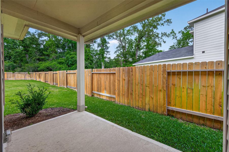 Exterior details and patio area of a home in , Huffman (Image 20).