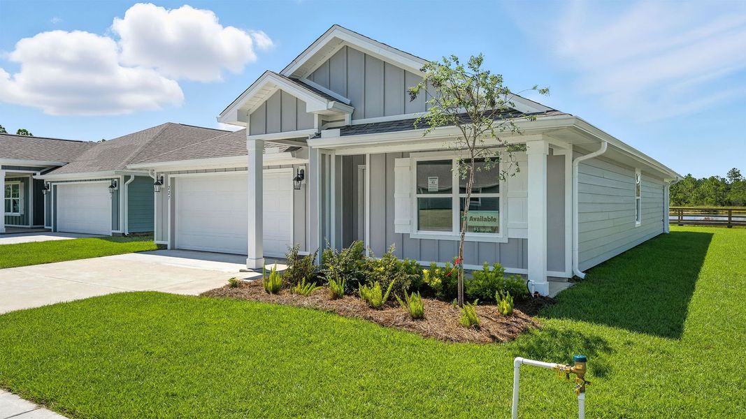 Front exterior of a new home in Palmetto Bluff, Port Saint Joe, FL, highlighting curb appeal (Image 2).