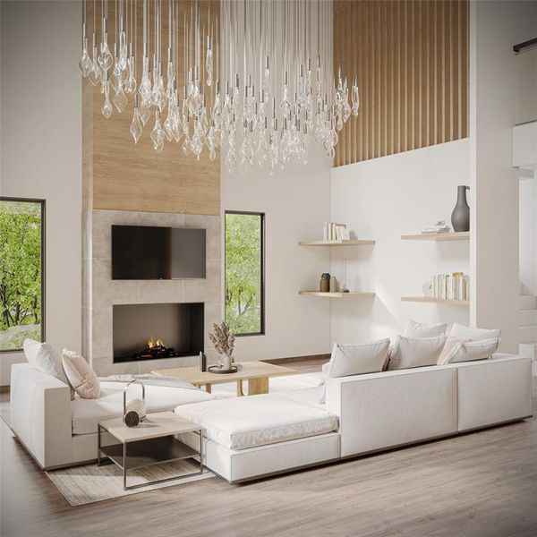 Living room featuring a tile fireplace, a high ceiling, hardwood / wood-style flooring, and an inviting chandelier