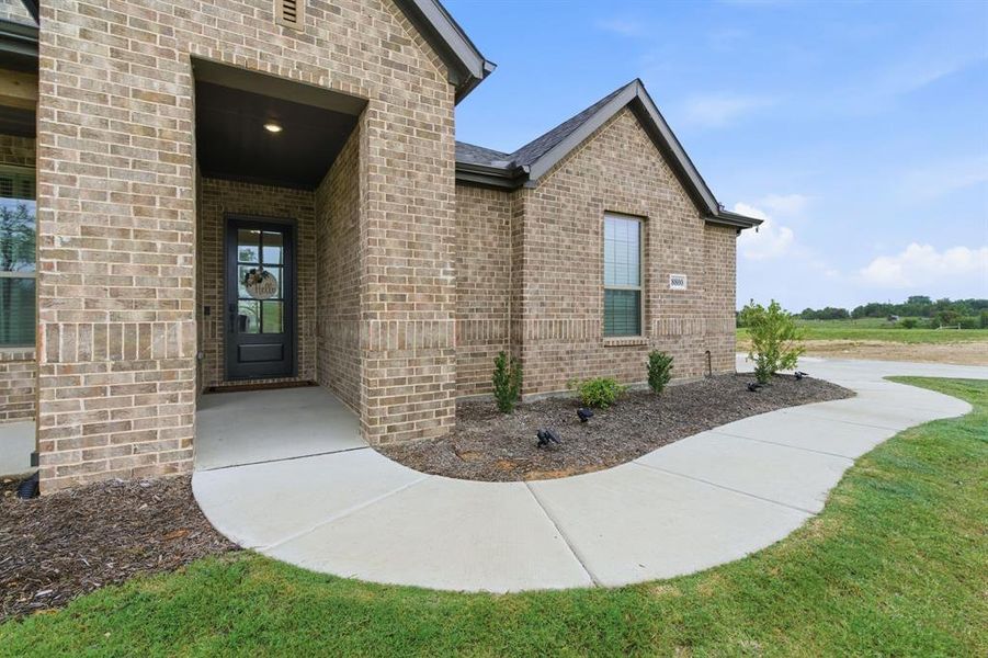 Exterior details and patio area of a home in Gatlin Ranch, Springtown (Image 4).