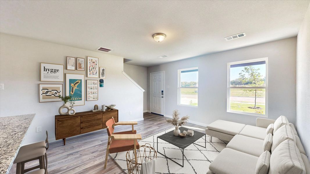 A living room with a couch and a table.